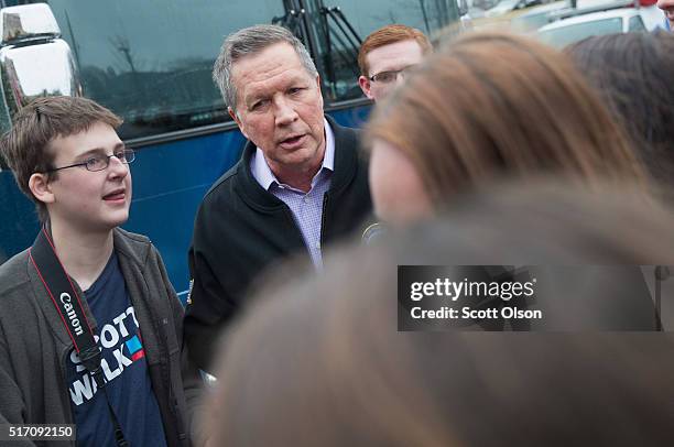 Republican presidential candidate Ohio Gov. John Kasich greets guests following a campaign rally at the Crowne Plaza Milwaukee West hotel on March...