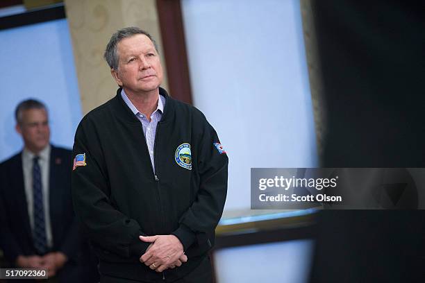 Republican presidential candidate Ohio Gov. John Kasich waits to be introduced at a campaign rally at the Crowne Plaza Milwaukee West hotel on March...