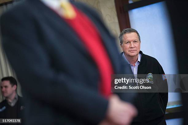 Republican presidential candidate Ohio Gov. John Kasich waits to be introduced at a campaign rally at the Crowne Plaza Milwaukee West hotel on March...