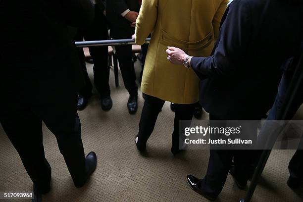 Secret Service agents stand guard behind democratic presidential candidate former Secretary of State Hillary Clinton after she delivered a...