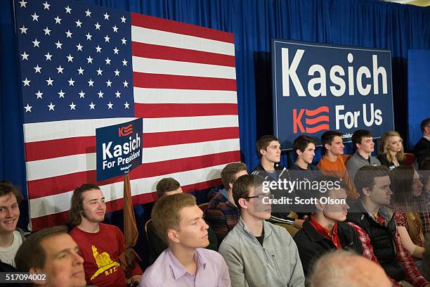 Supporters wait for the arrival of Republican presidential candidate Ohio Gov. John Kasich at a campaign rally at the Crowne Plaza Milwaukee West...