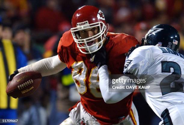 Kansas City Chiefs tight end Tony Gonzalez is brought down by Philadelphia Eagles free safety Brian Dawkings during the third quarter of the Eagles...