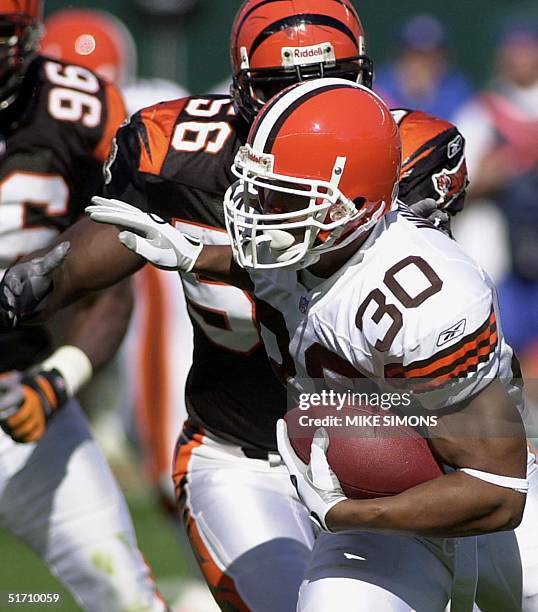 Cleveland Browns' Jamel White is pursued by Cincinnati Bengals' Brian Simmons 14 October 2001 at Paul Brown Stadium in Cincinnati, OH. Cincinnati...
