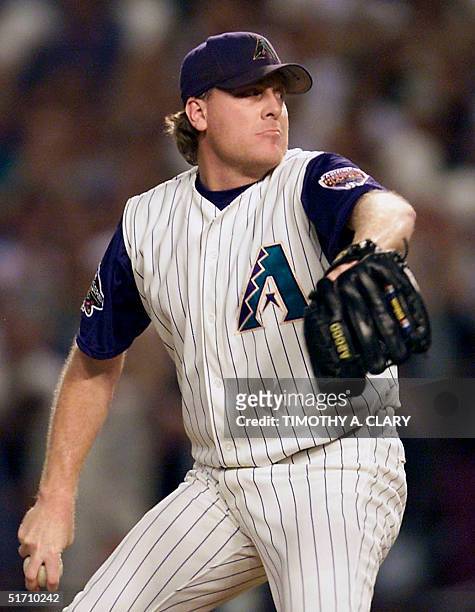 Arizona Diamondbacks' starting pitcher Curt Schilling winds-up for a pitch to the plate during the 1st inning of Game 7 of the World Series against...