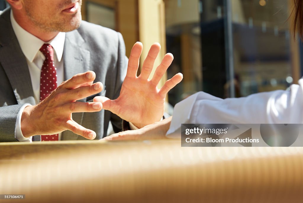 Business mans hands making a gesture