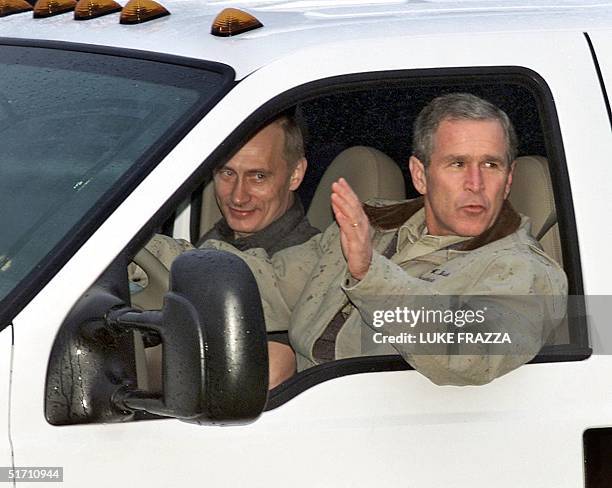 President George W. Bush drives Russian President Vladimir Putin 14 November 2001 at Bush's ranch in Crawford, Texas. Barbecue and ballistic missiles...