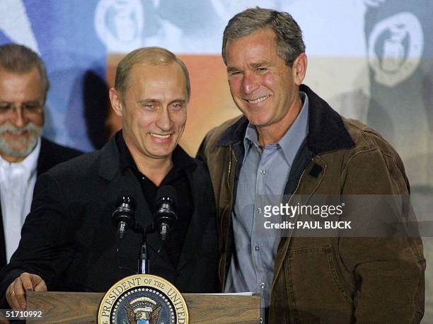 Russian President Vladimir Putin and US President George W. Bush smile following press conference at Crawford High School in Crawford, Texas 15...
