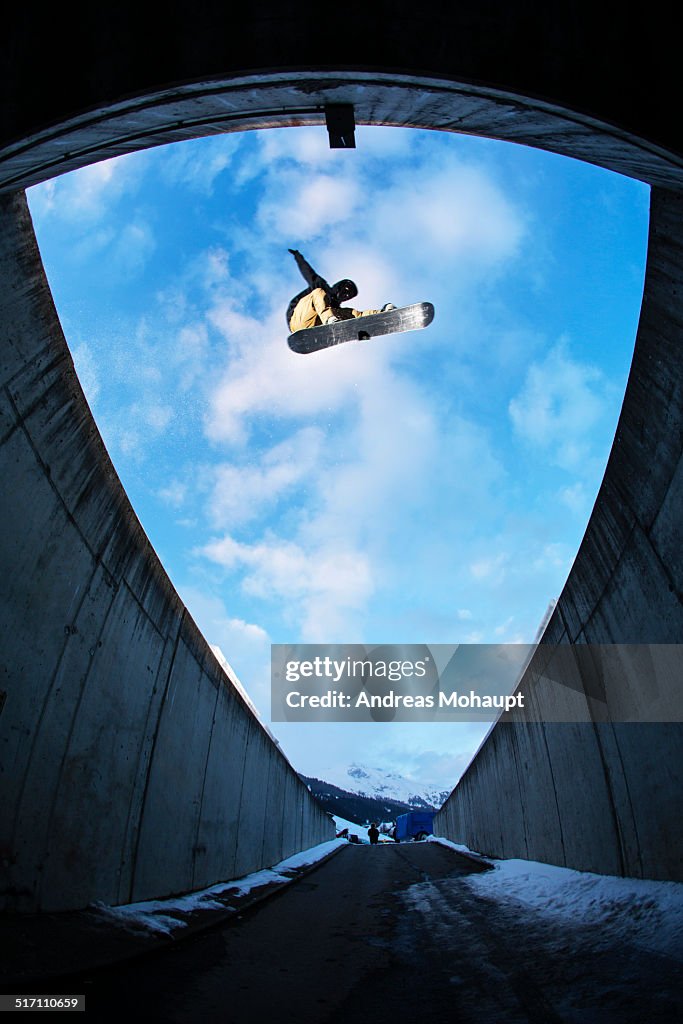 A professional snowboarder performing a trick