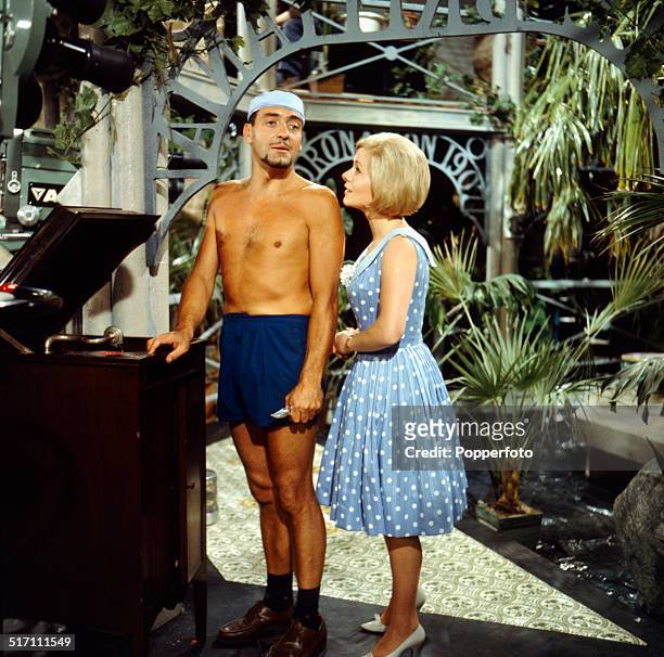 English actor Harry H. Corbett pictured with actress Miranda Connell in a scene from the television drama 'The Hot House' in 1964.