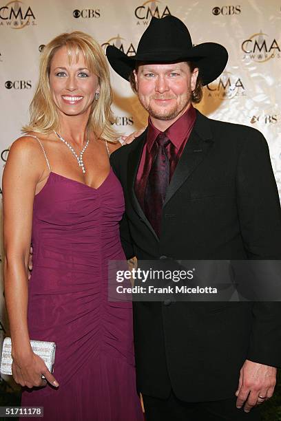 Tracy Lawrence and his wife Becca arrive at the 38th Annual CMA Awards at the Grand Ole Opry House November 9, 2004 in Nashville, Tennessee.