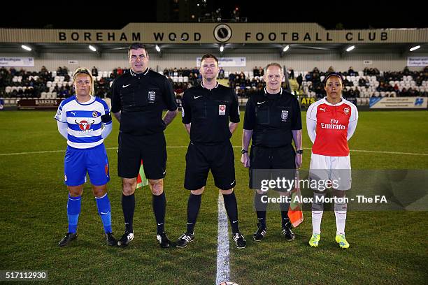 Kirsty McGhee of Reading and Alex Scott of Arsenal line up with the match officials ahead of the FA WSL match between Arsenal Ladies FC and Reading...