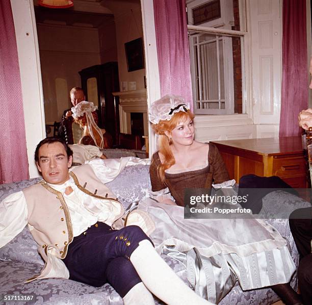 English actor Richard Johnson pictured with American actress Kim Novak on the set of the film 'The Amorous Adventures of Moll Flanders' in 1965.