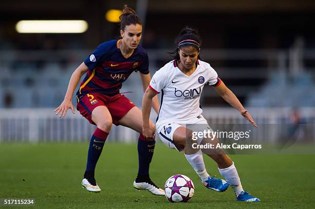 Shirley Cruz of Paris Saint-Germain protects the ball from Melanie Serrano of FC Barcelona during the UEFA Women's Champions League Quarter Final...