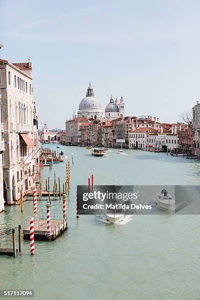view down the grand canal towards santa maria della salute, venice italy. - venizia stock pictures, royalty-free photos & images