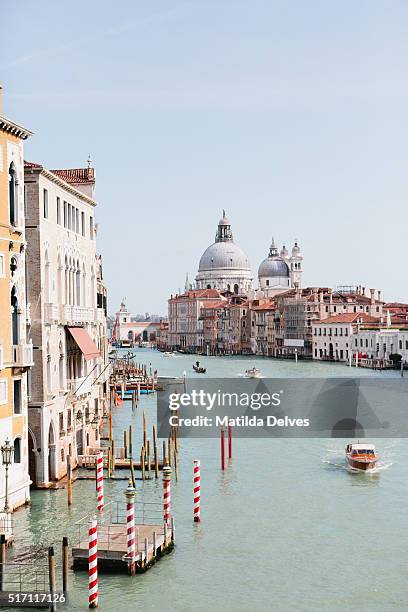 view down the grand canal towards santa maria della salute, venice italy. - venizia stock pictures, royalty-free photos & images