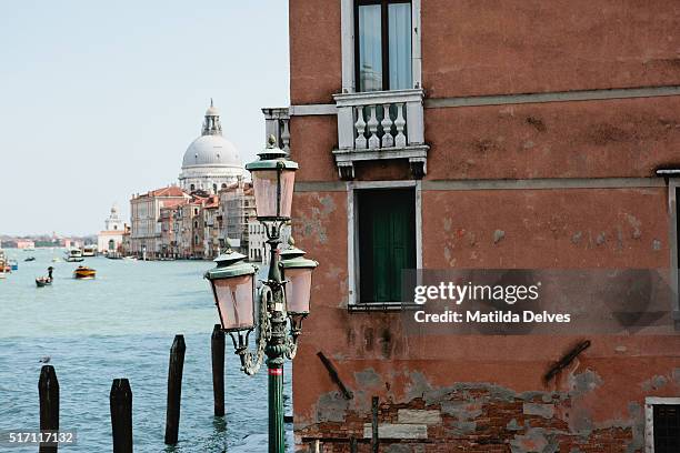 view down the grand canal towards santa maria della salute, venice italy. - venizia stock pictures, royalty-free photos & images