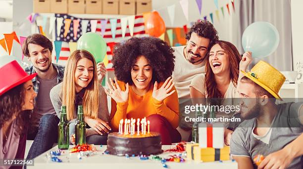 colleagues celebrating birthday party in the office - surprise birthday party stock pictures, royalty-free photos & images