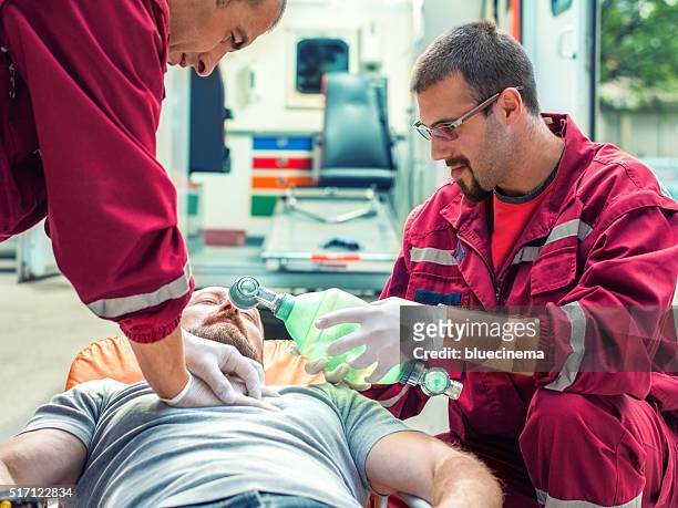 emergency service rescuing an infarcted - red crescent stock pictures, royalty-free photos & images