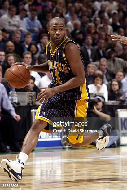 Jamaal Tinsley of the Indiana Pacers drives to the basket against the Minnesota Timberwolves on November 9, 2004 at the Target Center in Minneapolis,...