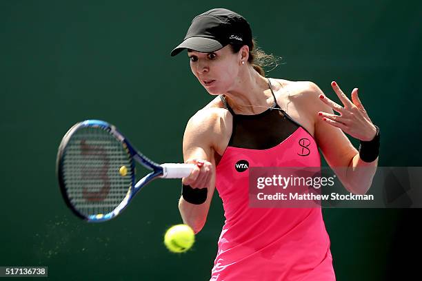 Galina Voskoboeva of Kazakhstan returns a shot to Alize Cornet of France during the Miami Open presented by Itau at Crandon Park Tennis Center on...