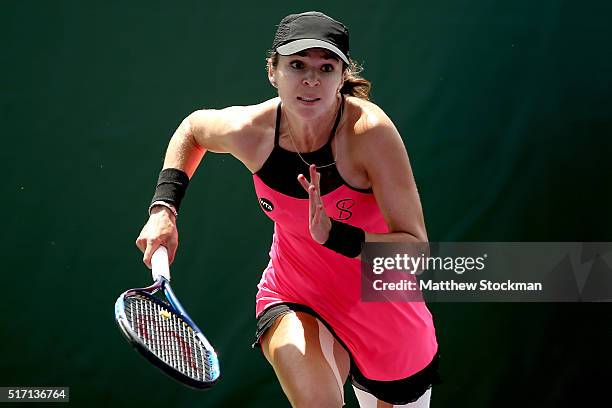 Galina Voskoboeva of Kazakhstan runs to the net while playing Alize Cornet of France during the Miami Open presented by Itau at Crandon Park Tennis...