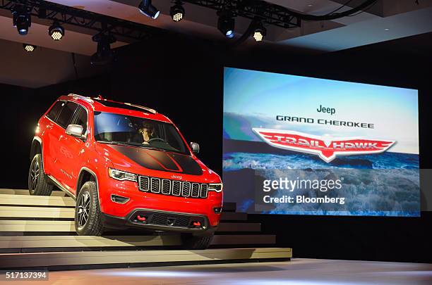 The Chrysler Group LLC Jeep Cherokee Trailhawk sports utility vehicle is driven down stairs on stage during the 2016 New York International Auto Show...