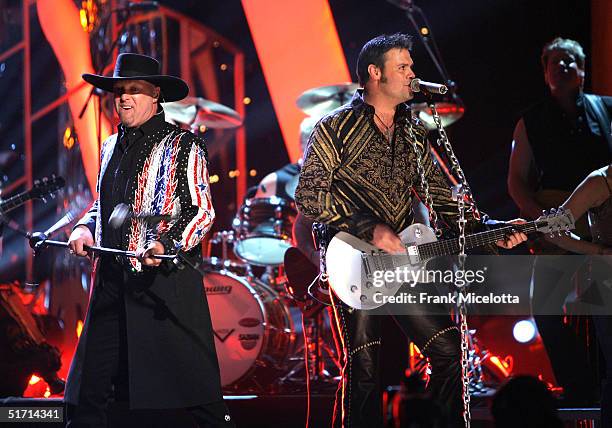 Eddie Montgomery and Troy Gentry of Montgomery Gentry perform on stage at the 38th Annual CMA Awards at the Grand Ole Opry House November 9, 2004 in...