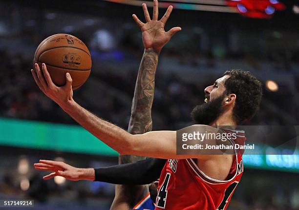 Nikola Mirotic of the Chicago Bulls puts up a shot past of Derrick Williams of the New York Knicks on hi s way to a game and career high 35 points at...