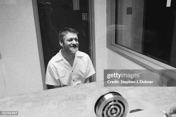 American domestic terrorist, luddite, and mathematics teacher Ted Kaczynski sits and smiles during an interview in a visiting room at the Federal ADX...