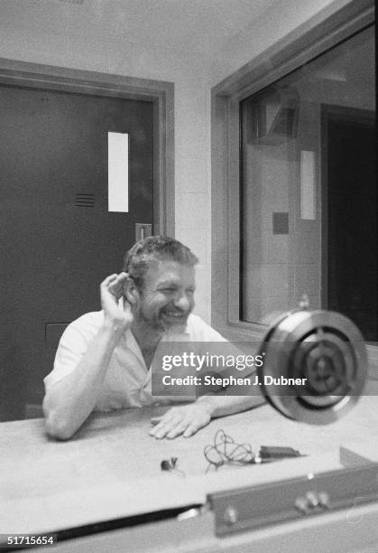 American domestic terrorist, luddite, and mathematics teacher Ted Kaczynski smiles and cups his hand to his ear during an interview in a visiting...