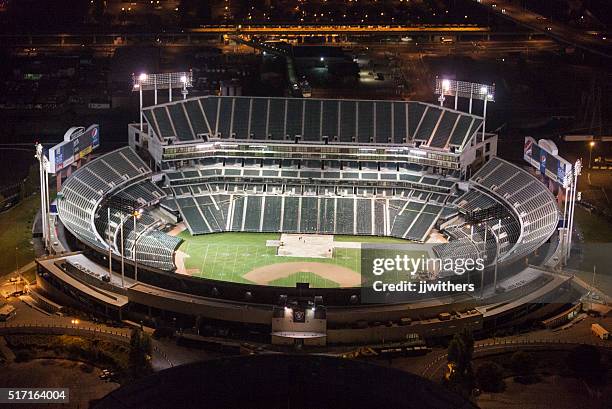 oakland coliseum vacant at night seen from above - oakland california night stock pictures, royalty-free photos & images