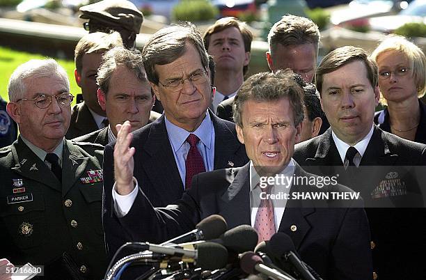 Senate Majority Leader Tom Daschle , D-SD, with Major General John S. Parker , USA Medical Research and Material Command, US Senate Minority Leader...