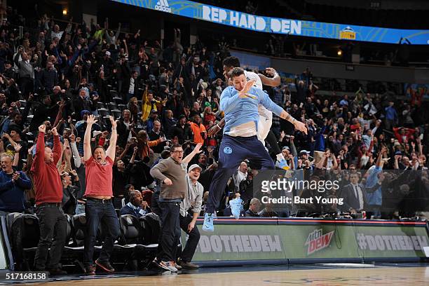 Emmanuel Mudiay of the Denver Nuggets celebrates with Mike Miller of the Denver Nuggets after hitting the game winning three point shot against the...