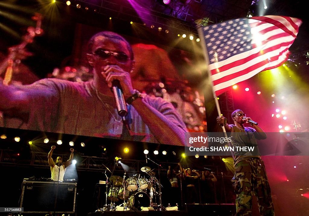 P Diddy waves a flag during his performance 21 October 2001 at the
