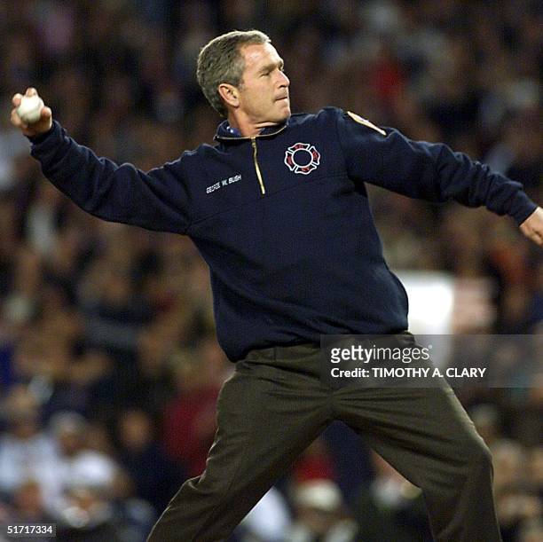 President George W. Bush throws the ceremonial first pitch of Game 3 of the World Series in New York's Yankee Stadium 30 October, 2001. The Arizona...