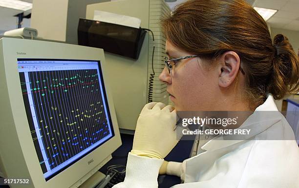 Wendy Sorensen a lab technician for Myriad Genetics of Salt Lake City, Utah works on 85 lines of extracted DNA on a computer from the New York State...