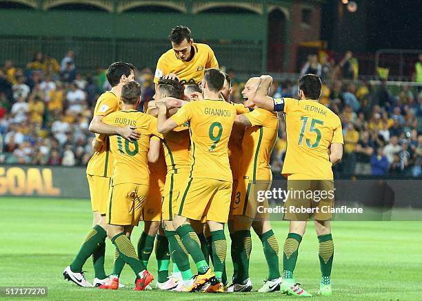 Massimo Luongo of Australia celebrates with team mates after scoring a goal during the 2018 FIFA World Cup Qualification match between the Australia...