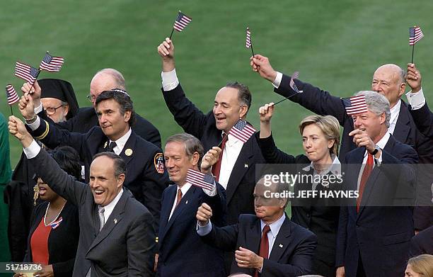 New York City Mayor Rudolph Giuliani leads a group in flag waving New York Gov. George Pataki, Acting New Jersey Gov. Donald T. DiFrancesco New York...