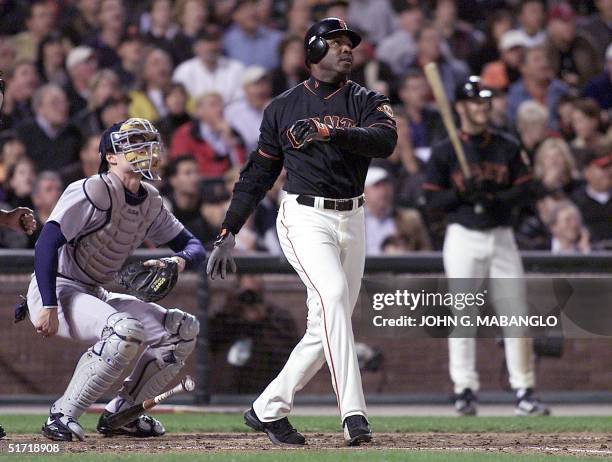 San Francisco Giants slugger Barry Bonds follows through with his 68th homerun of the season off San Diego Padres pitcher Jason Middlebrook as Padres...