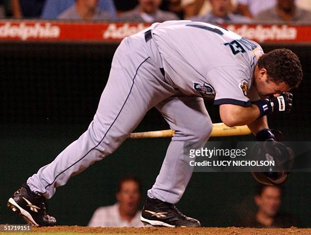 Seattle Mariners' Edgar Martinez holds his head after being hit by a pitch from Anaheim Angels' Lou Pote in Anaheim, CA, 02 October 2001. Martinez...