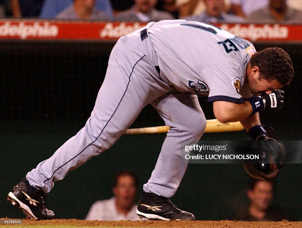 Seattle Mariners' Edgar Martinez holds his head af