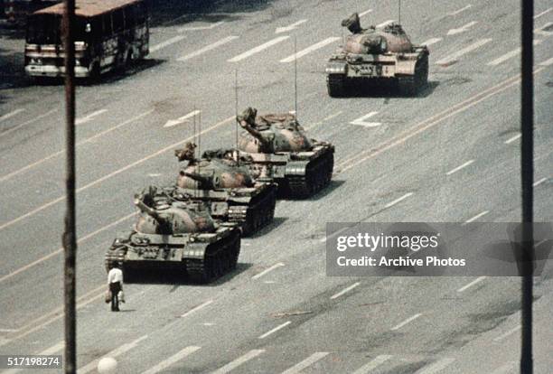 Beijing demonstrator blocks the path of a tank convoy along the Avenue of Eternal Peace near Tiananmen Square. For weeks, people have been protesting...
