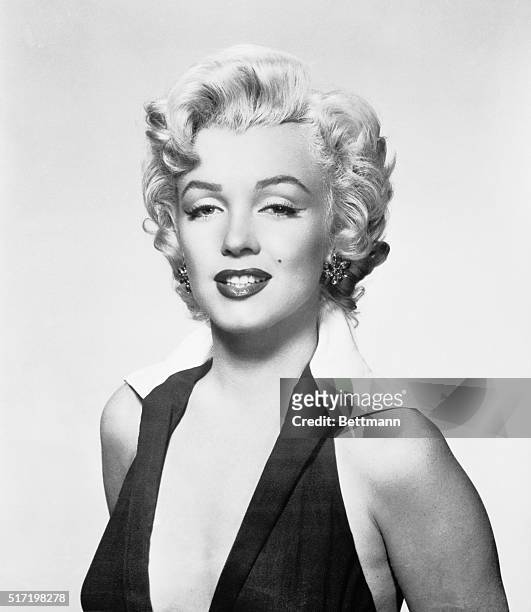 Marilyn Monroe wearing a halter dress in the shot made famous by artist Andy Warhol.