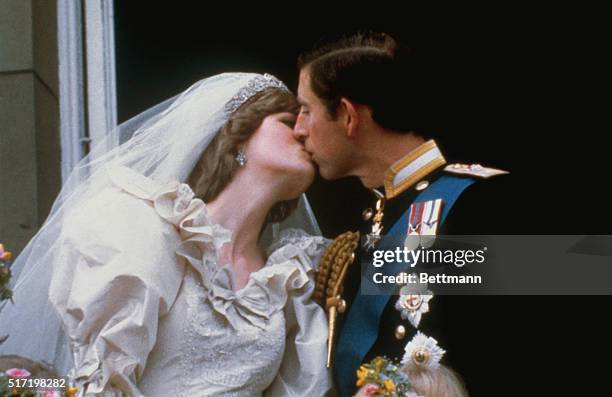 Wedding of Prince Charles and Lady Diana Spencer. Shows the famous kiss on the balcony of Buckingham Palace, after ceremony.