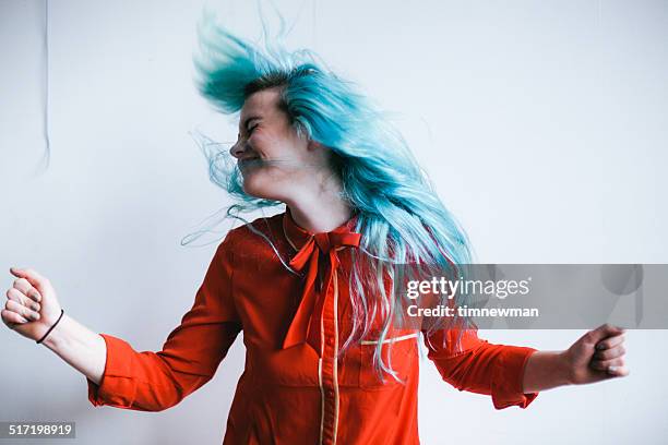 blue hair head bang - young woman bright colour stock pictures, royalty-free photos & images