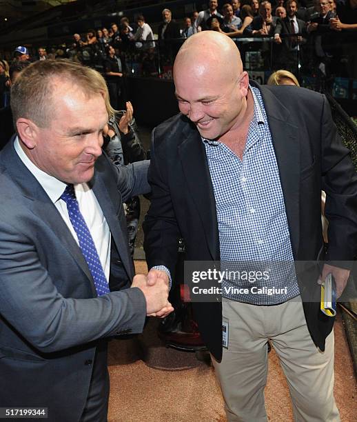 Trainer Peter Moody is congratulated by runner up trainer John O'Shea after Flamberge won Race 6, the Mitchelton Wines William Reid Stakes during...