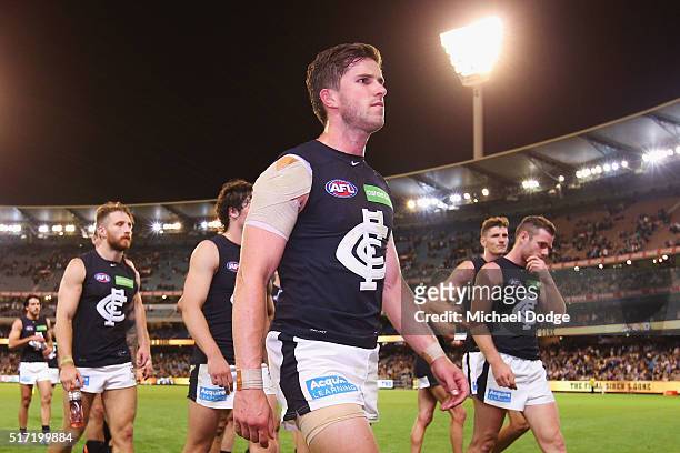 Marc Murphy of the Blues leads the team off after defeat during the round one AFL match between the Richmond Tigers and the Carlton Blues at...