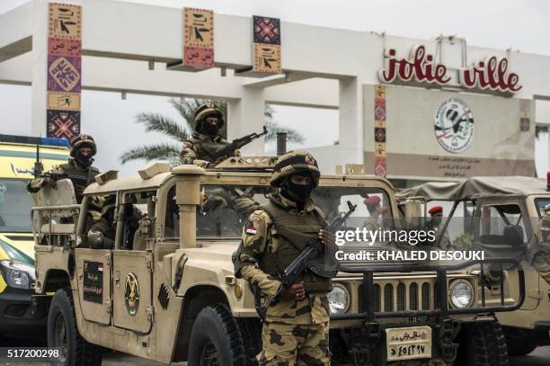 Members of the Egyptian army stand guard outside the venue of a conference for defence ministers and officials of the 27 members of CEN-SAD in...