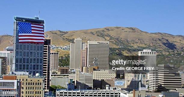 X 127' American flag hangs on top of the Salt Lake Olympic Committee 24 storey building in downtown Salt Lake City, Utah, 19 September, 2001. The...