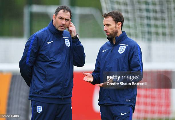 Gareth Southgate manager of England U21 and coach Paul Clement in discussion during an England U21 training session ahead of their UEFA U21 European...